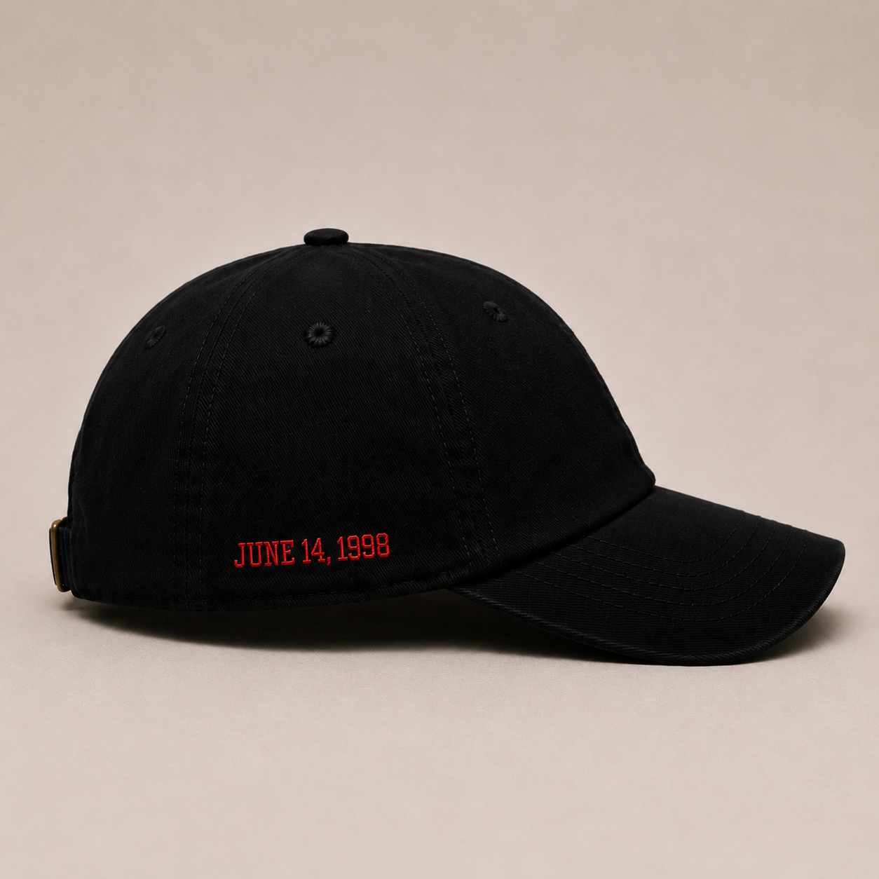 Side view of The Last Shot embroidered dad cap in black by Hai Tide highlighting the side embroidery, curved brim, adjustable fit, and premium cotton construction.