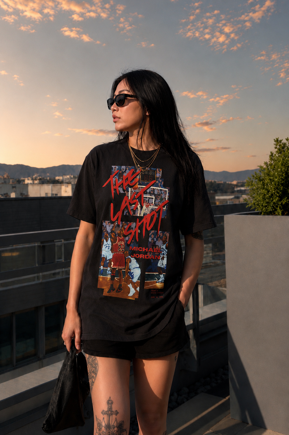 Model standing outdoors wearing The Last Shot Tee by Hai Tide in black, featuring original basketball-inspired artwork printed on a heavyweight cotton T-shirt.